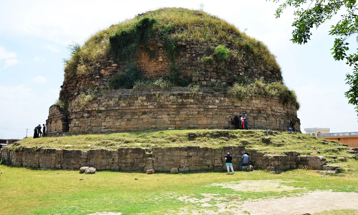The grass-topped dome of the Mankiala Stupa near Rawalpindi, Pakistan