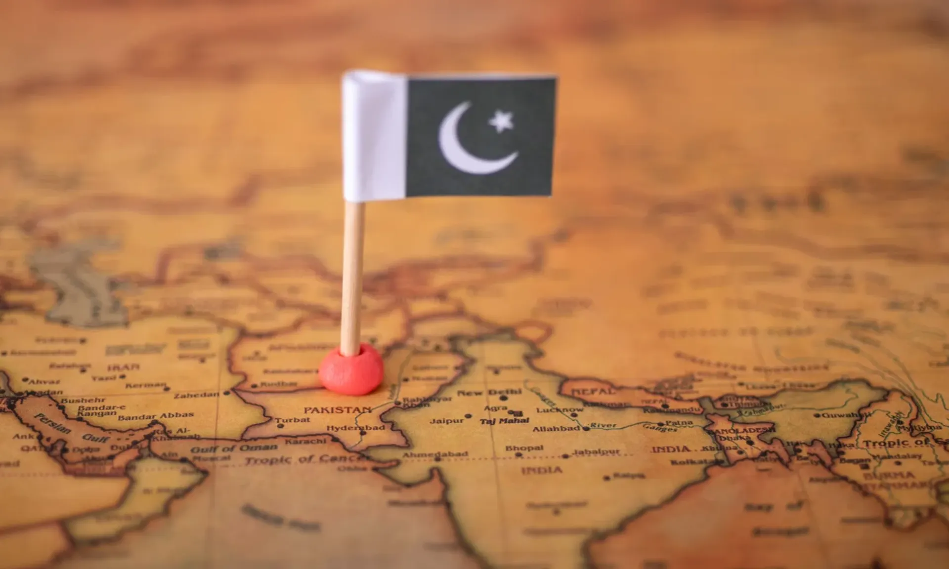 Pakistan flag pinned on a world map, Is Pakistan safe travel guide