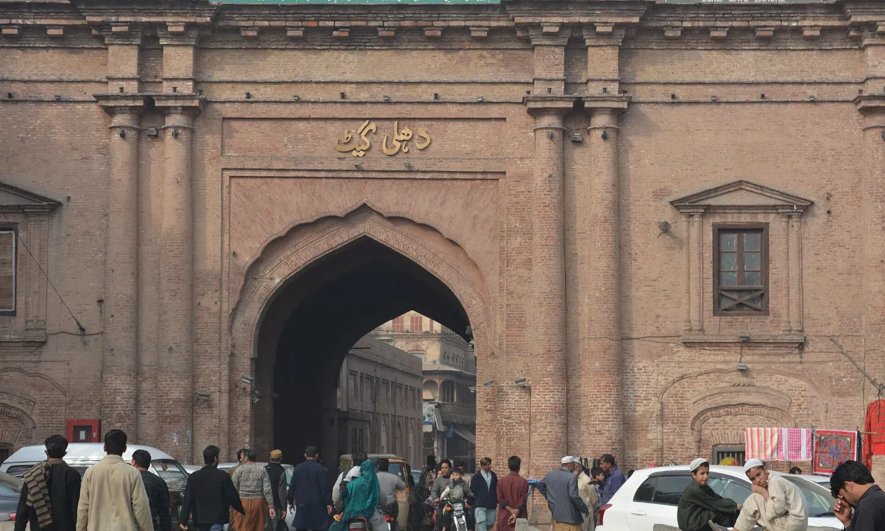 The Mughal-era Delhi Gate and its busy street in the Walled City of Lahore, Pakistan