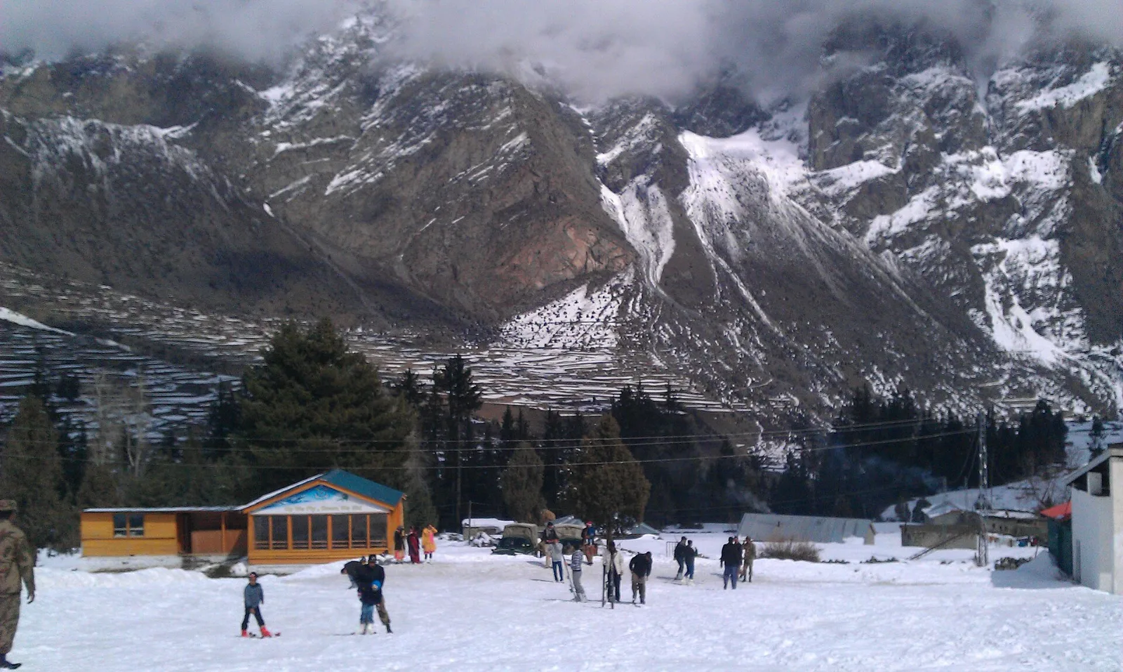 Skiers on the snow slopes of the Naltar ski resort near Gilgit, Pakistan