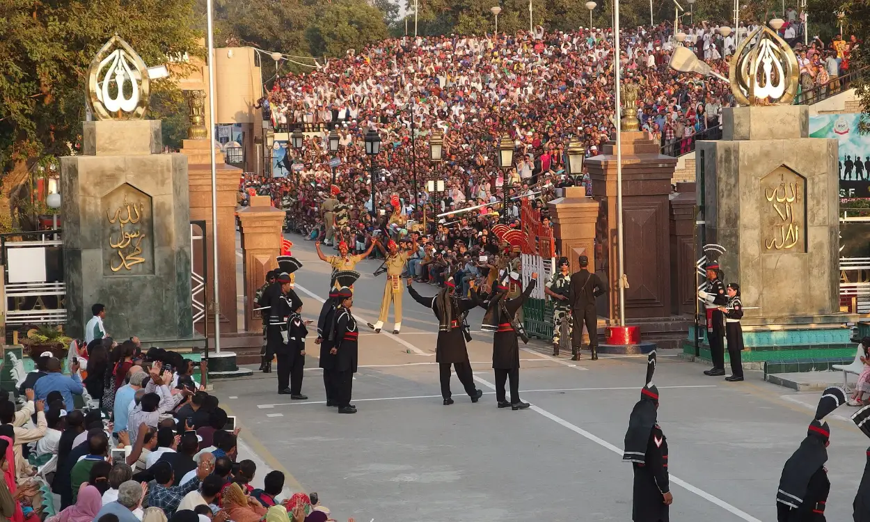 The flag-lowering ceremony at the Wagah border between Pakistan and India