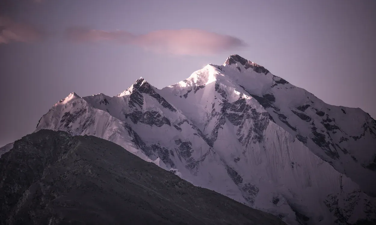 Rakaposhi (7,788 m) at dusk, seen on the Rakaposhi Base Camp Trek in Nagar, Pakistan