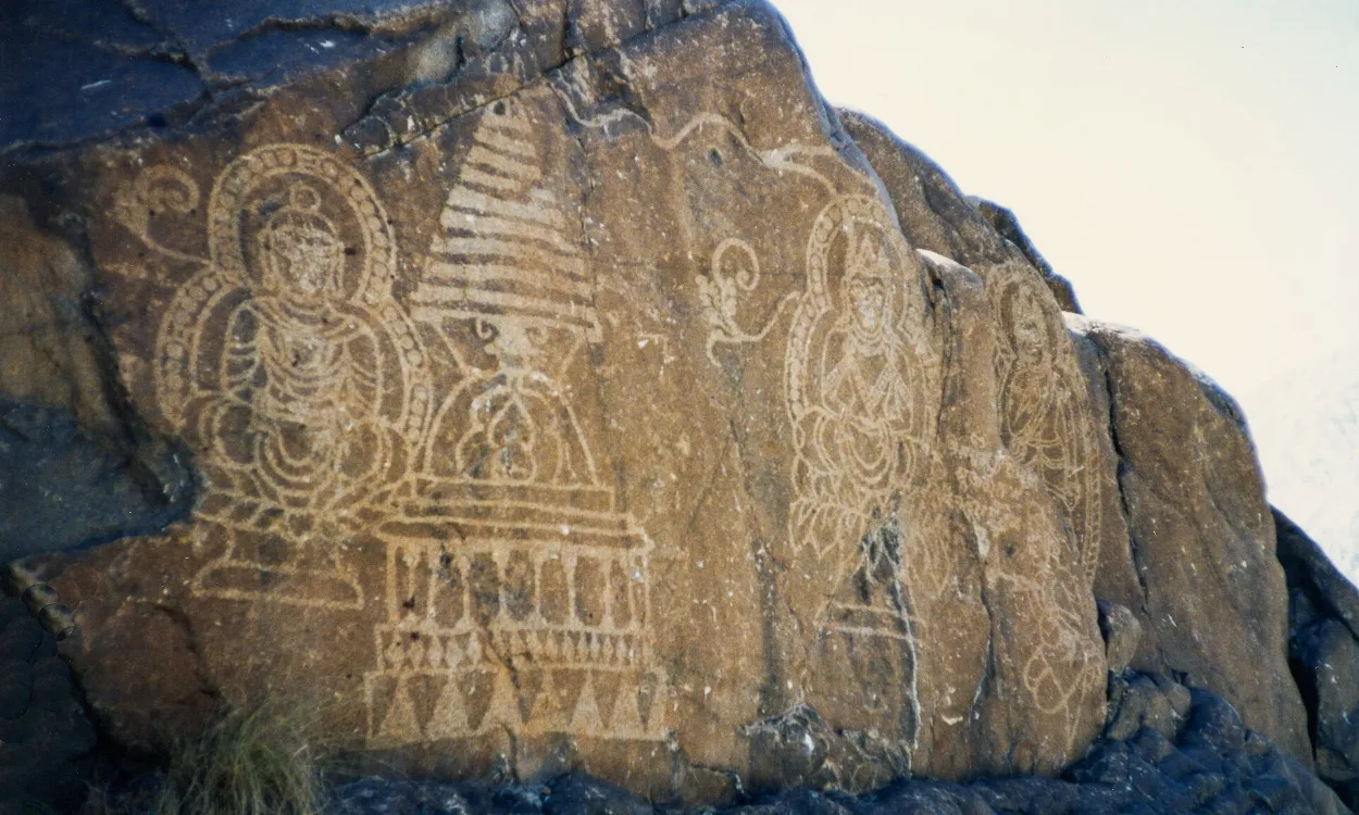 Ancient Buddhist stupa carvings on a rock along the Karakoram Highway near Chilas, Pakistan