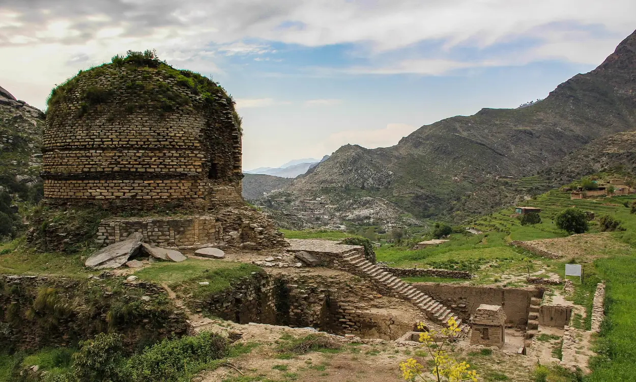 The Amluk Dara Stupa below the mountains of the Swat Valley, Pakistan