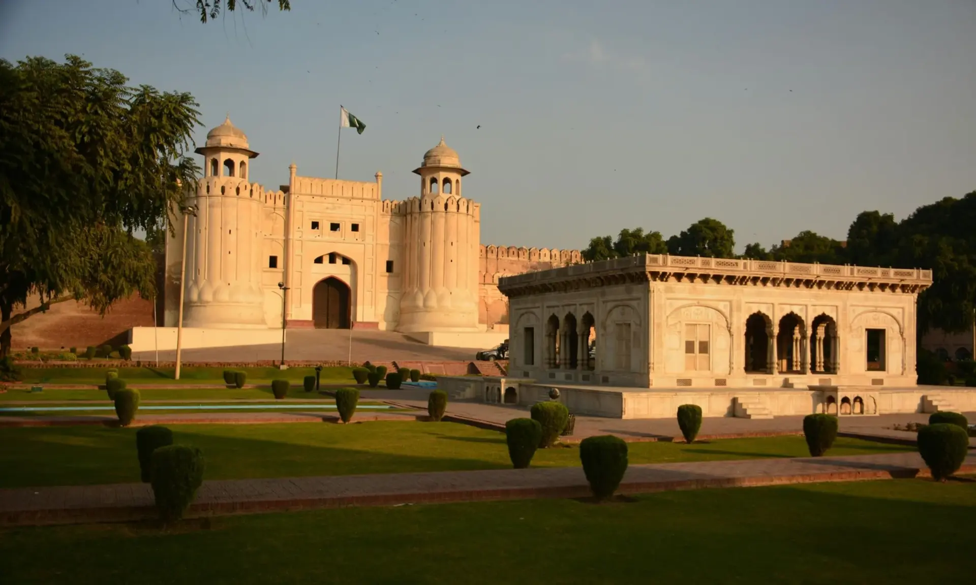 Alamgiri Gate of Lahore Fort and the Hazuri Bagh Baradari at sunset, Lahore, Pakistan